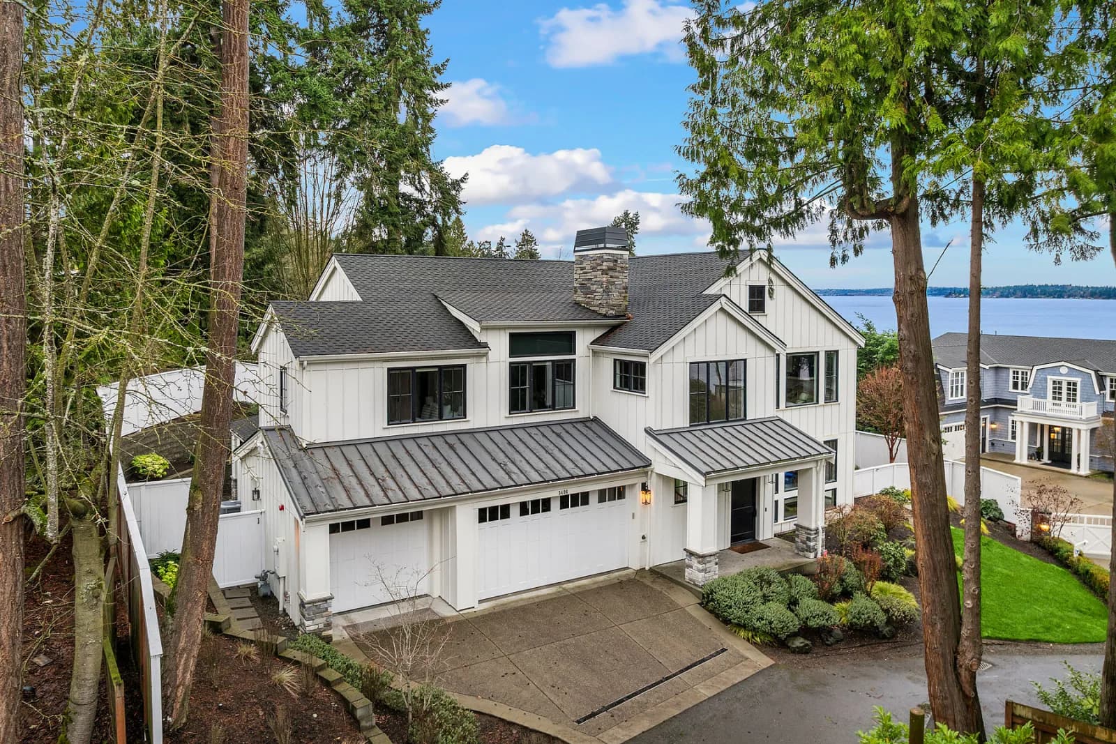 A white farmhouse-style home above Lake Washington on Mercer Island